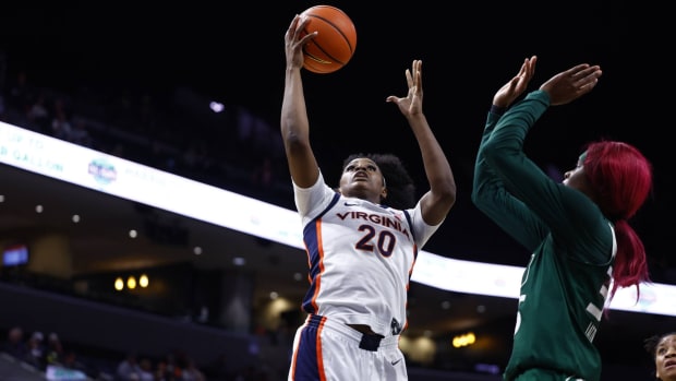 Camryn Taylor attempts a shot during the Virginia women's basketball game against Miami at John Paul Jones Arena.